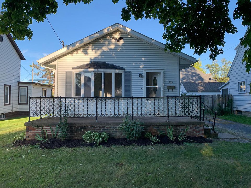 Front of house with large porch.