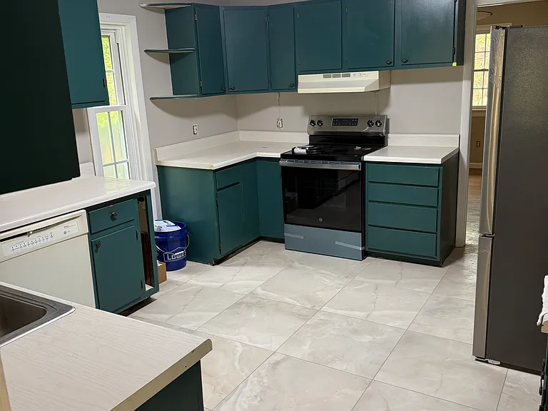Kitchen with Range, Dishwasher and refrigerator (new appliances) New cabinets, countertops fixtures
