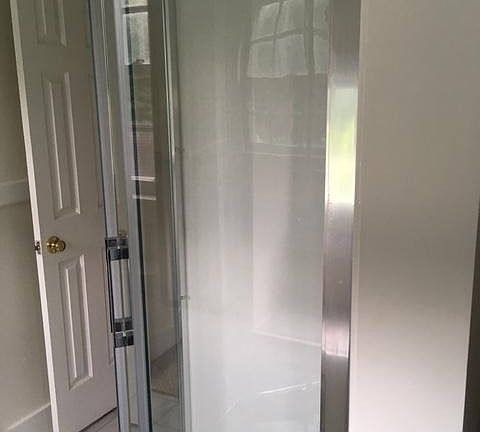 bathroom has new toilet and new shower