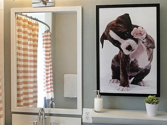 Upscale bathroom featuring framed vanity