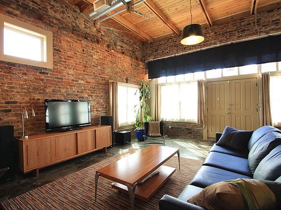 The living area sits a large group for your next movie night.