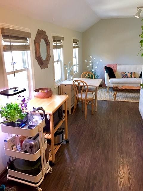 Bright sunny living area overlooking backyard