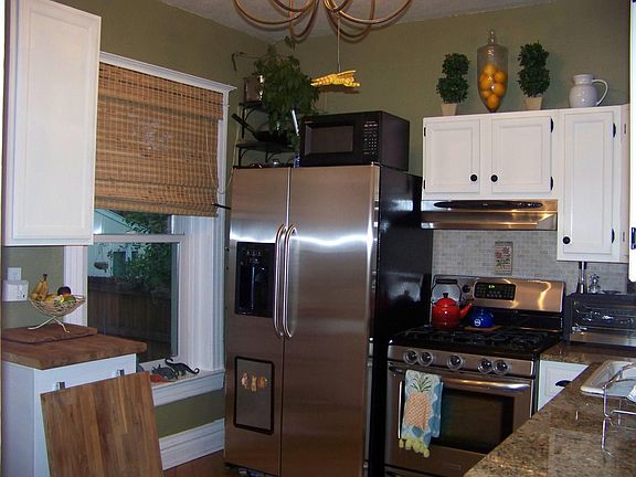 Kitchen with granite countertops and SS appliances. Gas range with a 5 burner top also.