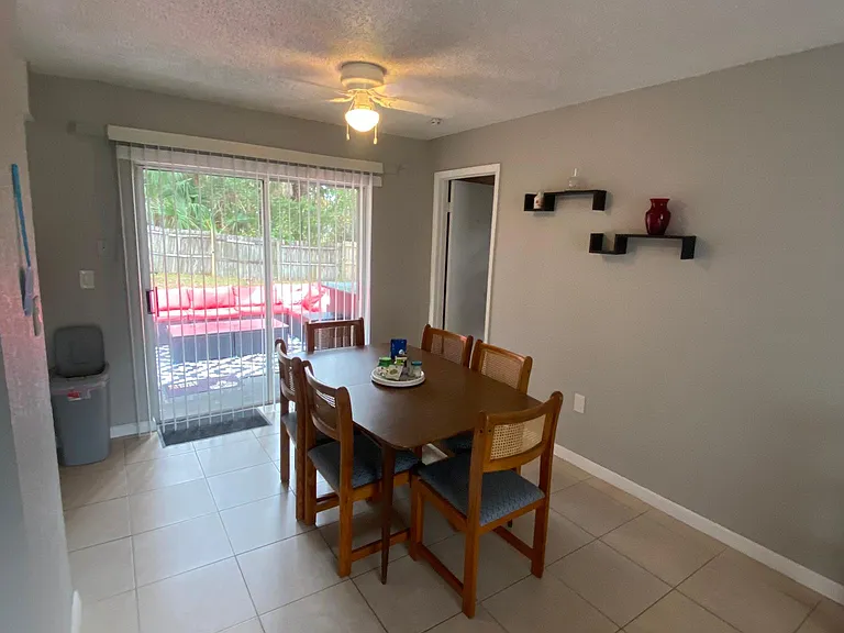 Dining room. Backyard furniture seen in back
