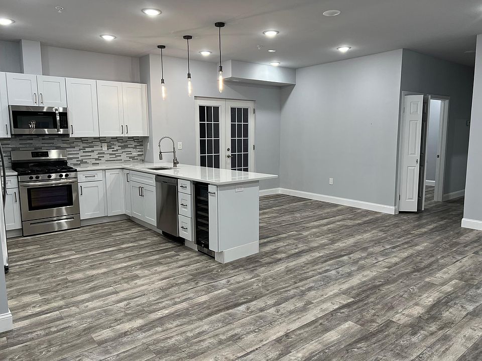 Kitchen, Dining, Living Area and Full Balcony