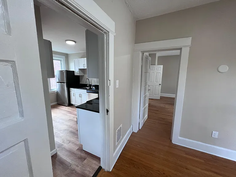Bedroom 3 with doors to the kitchen and Bedroom 2