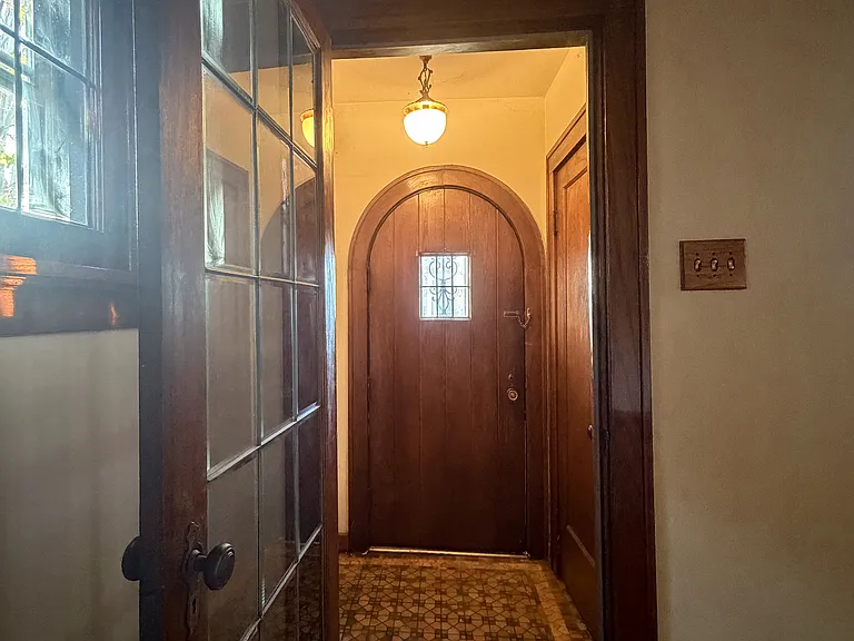 Original front door, coat closet, entry