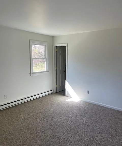 Bedroom and door to the bathroom