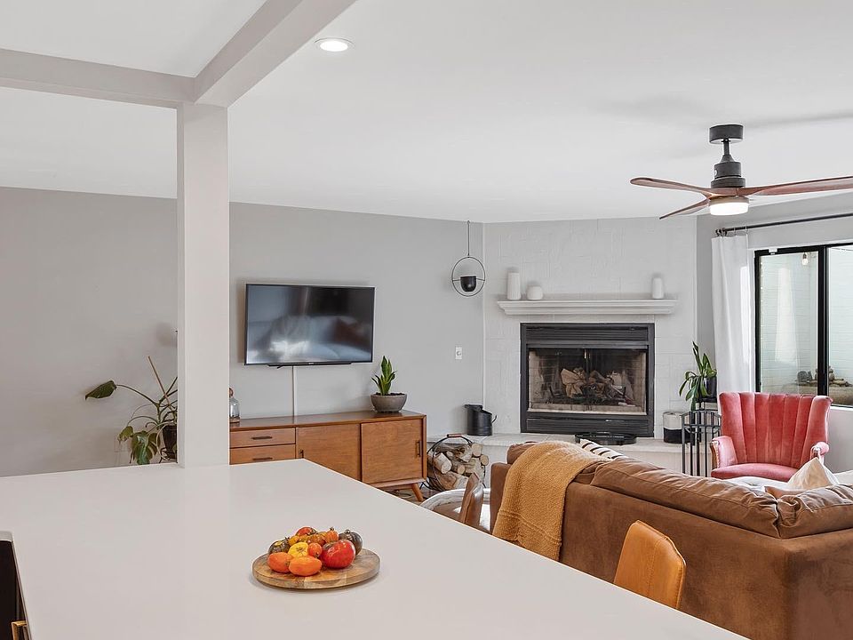 Brand new kitchen with quartz counters that open to the living and dining room