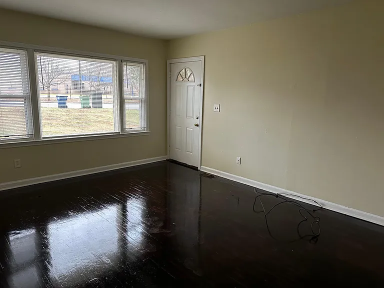 living room. BEAUTIFUL HARD WOOD FLOORING!!