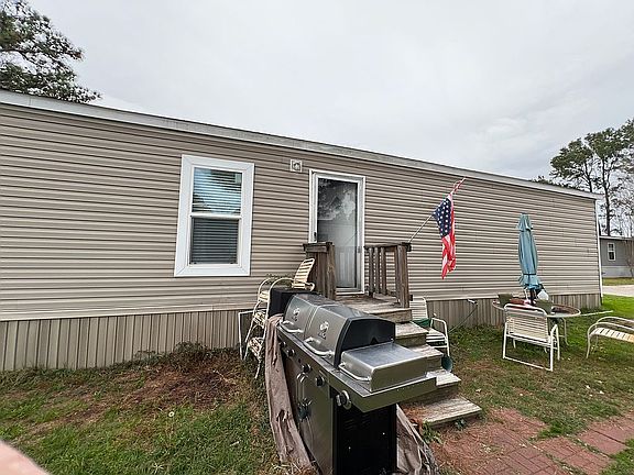 Side of home with front door