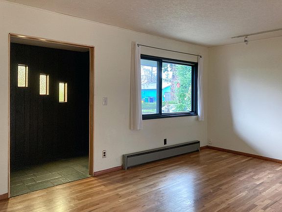 Entry way as seen from living room. There is a coat closet in the entryway.
