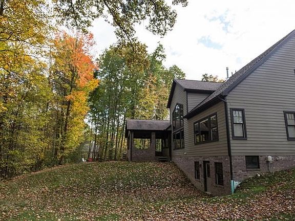 Hardi-plank and brick exterior of architectural quality with full walk out basement leading to the c