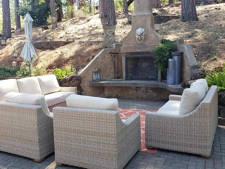 Shared outdoor fireplace...but you also have one in your LR.