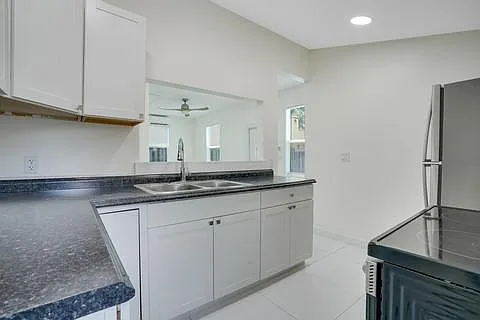Kitchen facing living room/entry