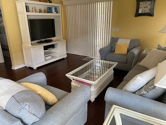 Living room with 50" TV, cable TV, printer, DVD, chess game, books and more!
