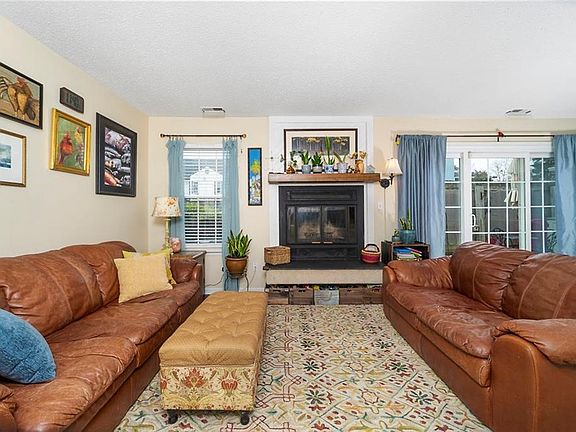 Newer windows and wood burning fireplace.  8 Ft Slider