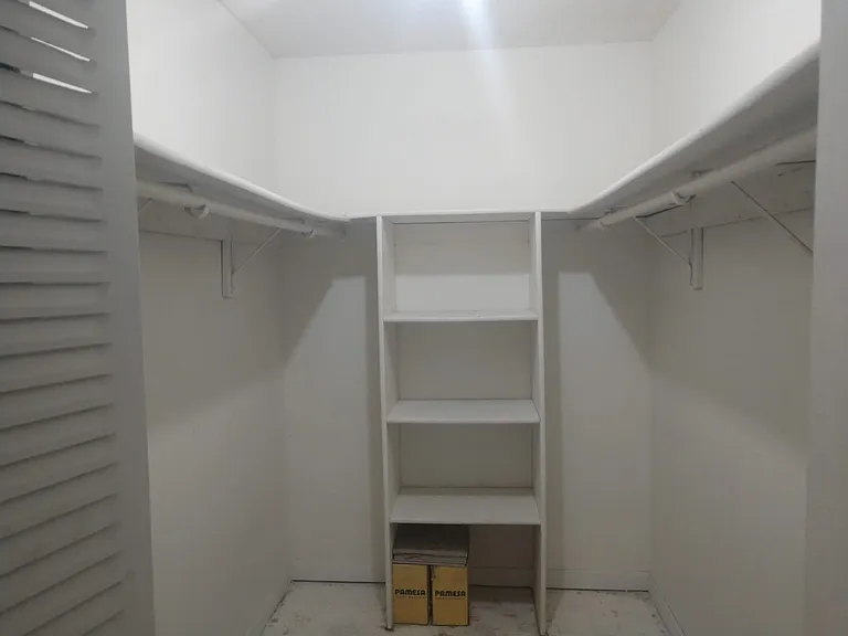 1st walk-in closet (in bedroom)