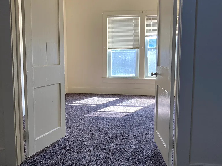 View from the living room into bedroom 1.