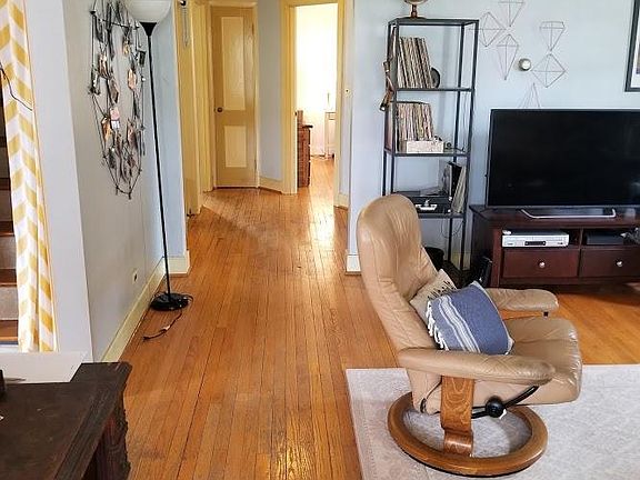 This is another view of the living room as you enter from the front door, as set up by a former tenant