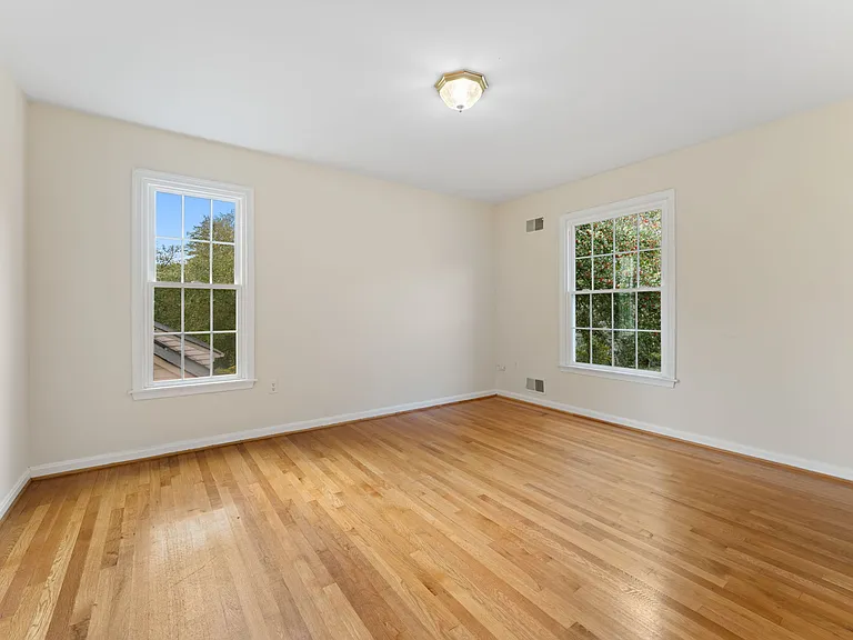 3rd bedroom sports hardwood floors and spacious closet