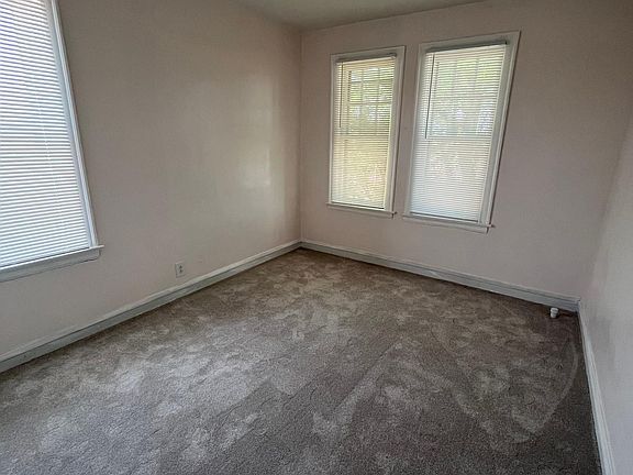 Front bedroom_walk-in closet; new high end carpeting and ceiling fan with remote