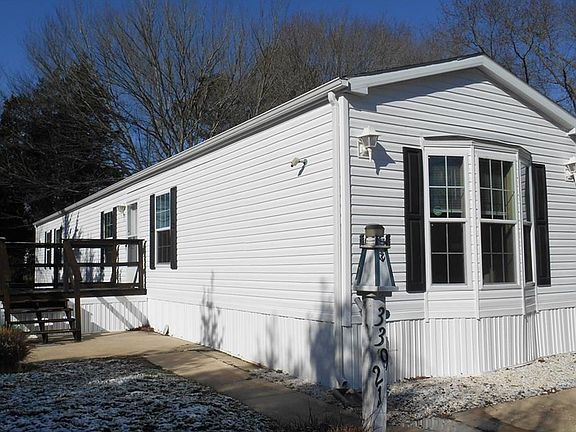 Side of home with large deck
