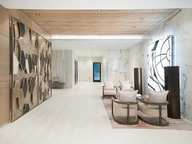 A refined lobby lounge with layered textures, curated seating, and welcoming spaces to pause or connect.