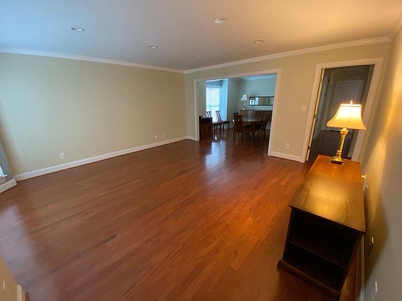Huge living room from the front door, leads to the separate dining room. Hall way to the bedrooms through the right doorway.