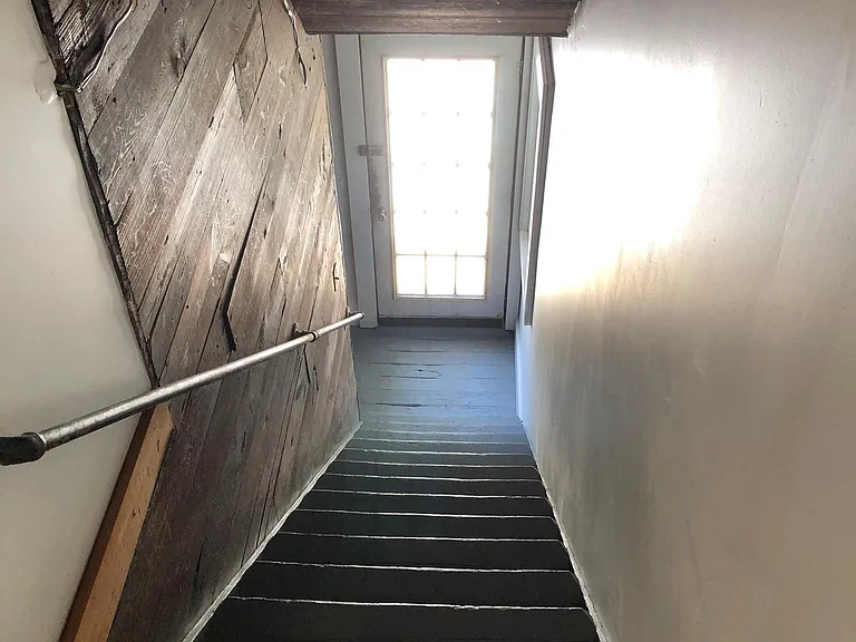 Back staircase to patio/driveway