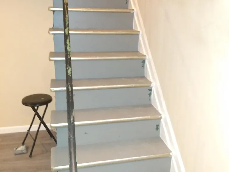 Stairs to large bedroom in basement