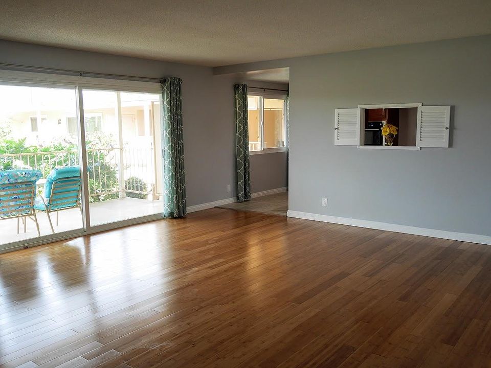 Spacious living room w/ courtyard view