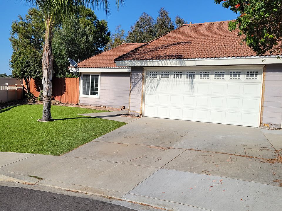 2 car garage, low maintenance with artificial grass in front yard.