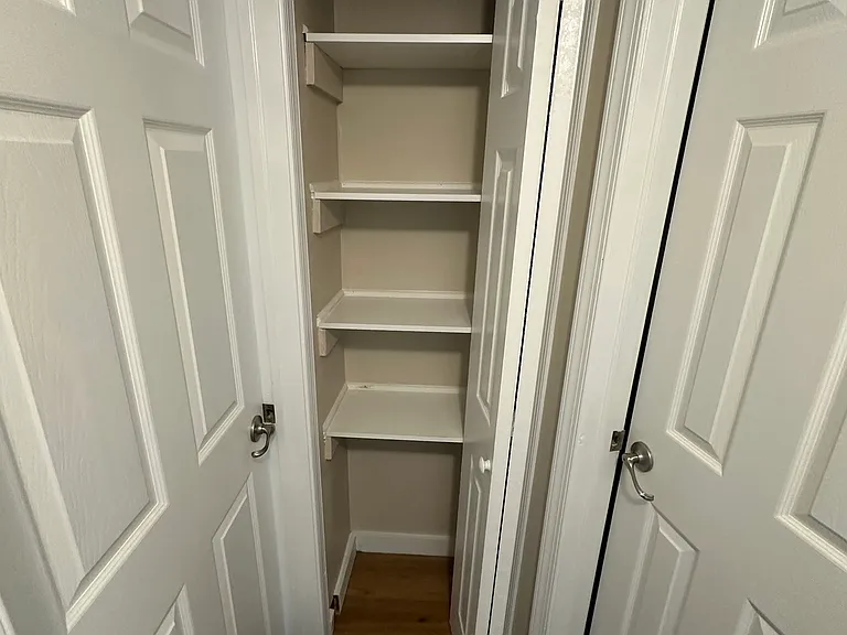 Linen closet with build-in shelving