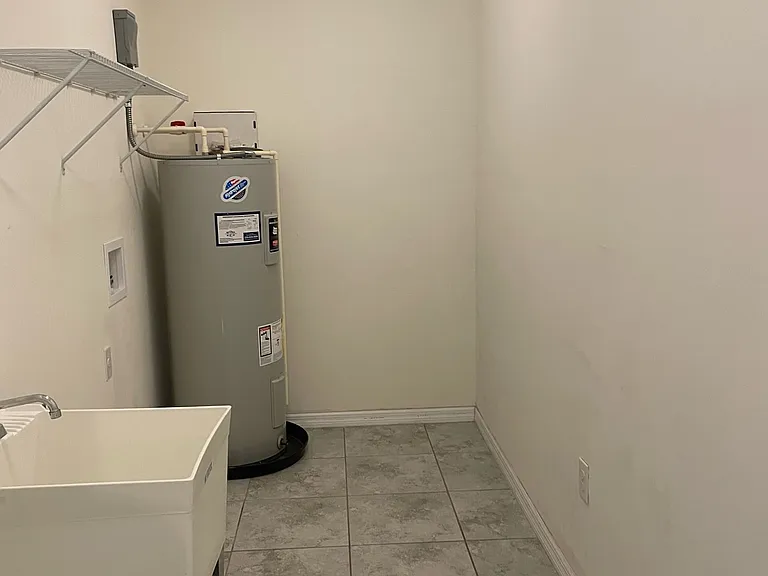 Laundry Room with sink, hook ups for appliances.
