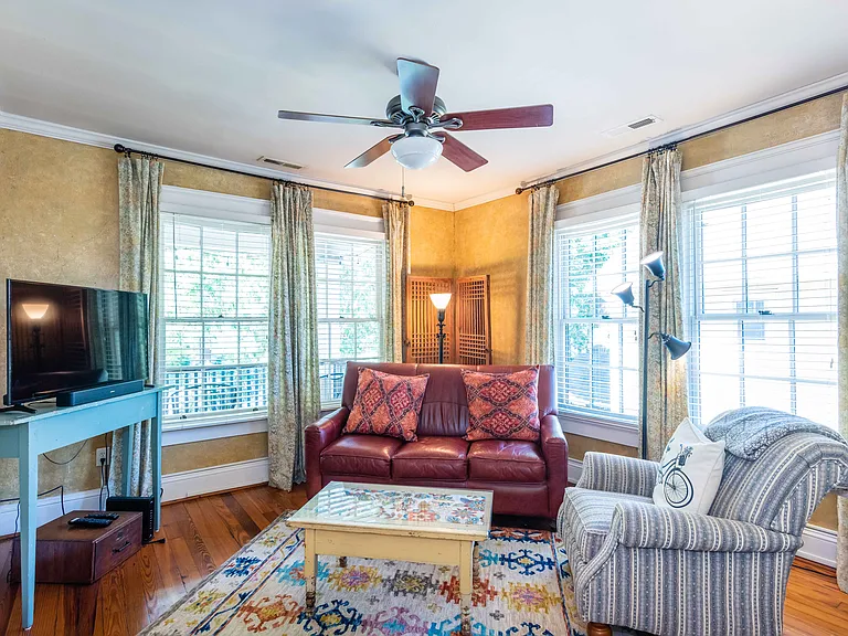 Living room
+TV
+Fireplace (non-functional) 
+Large sofa
+Large windows