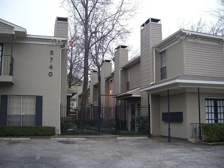 front entrance with double security gates - locked electric gate to parking lot, and additional locked gate to enter the courtyard