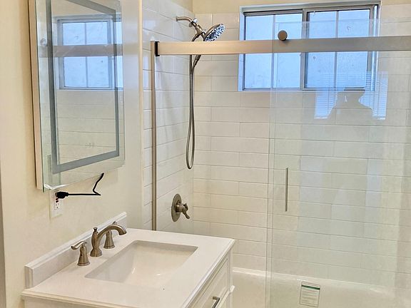 Newly renovated bathroom with LED Mirror with adjustable lights and anti-fog feature.