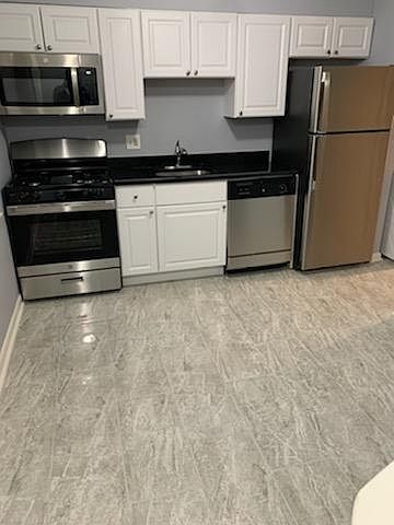 Updated Kitchen with Stainless Steel Applicances, Beautiful Granite Counter Top, Ceramic Flooring and Cabinetry