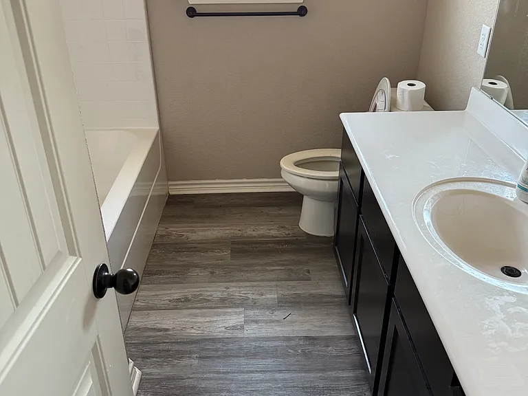 Spare Bathroom 1 with Updated Flooring