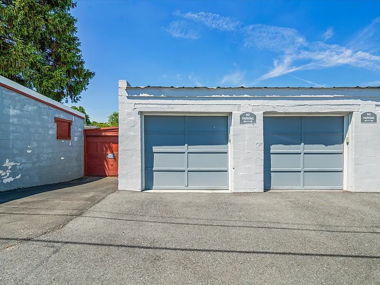 Two bay garage - previous occupants used them for cars, but could be optimized for a gym or storage. There is street parking available at the front of the home.