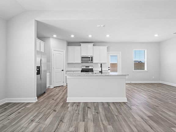 The kitchen of the Keaton has a wonderful island and granite counter tops.