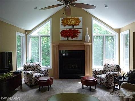Main floor living room with gas fireplace.