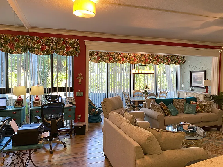 Small desk for any work needed. Dining area looking out the sliding glass doors.
