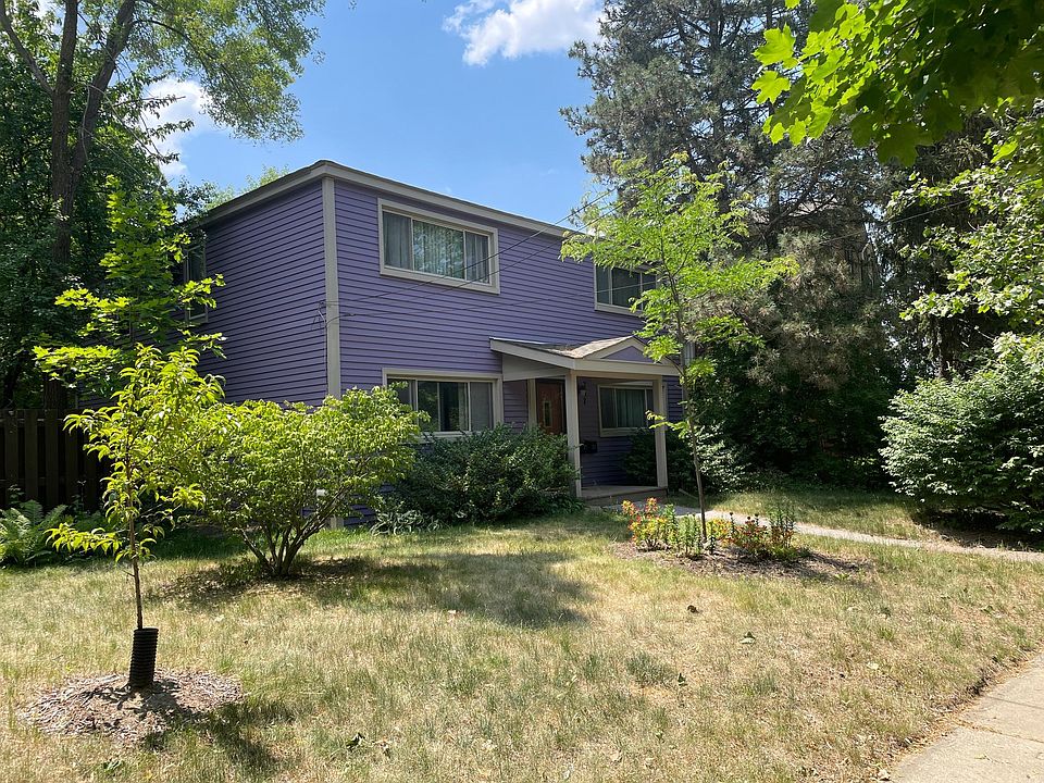 Front of home shows upper unit with large window