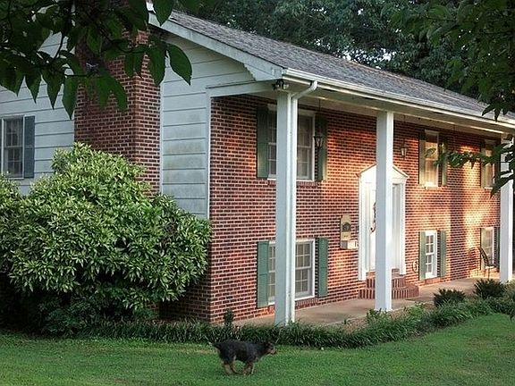 View to the detached 2 car garage : A place for hobbies, cars, boat, more & big enough to convert to