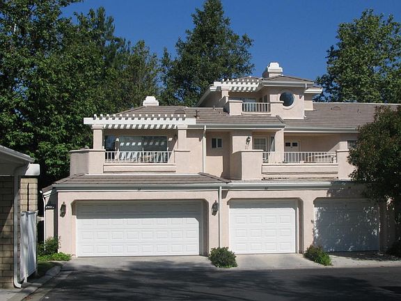 Front with Attached 2-car garage; Balcony from Upper Main Room