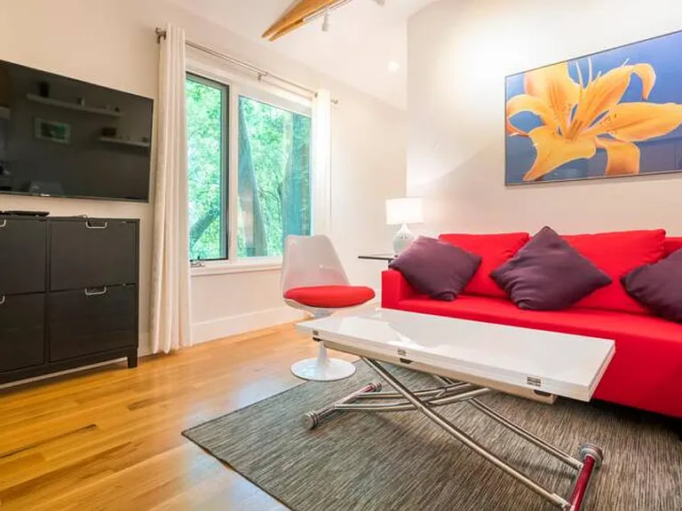 The 52 inch TV is included with the lease and has a Amazon firestick. Also included: curtains, side table, small lamp, expanding coffee table. NOT included: chair and couch and artwork.