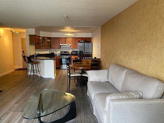 Fully-furnished unit including new hardwood floors, two plasm television sets - - living room and bedroom, dining set, sofa, bedroom set and a washer & dryer in the unit