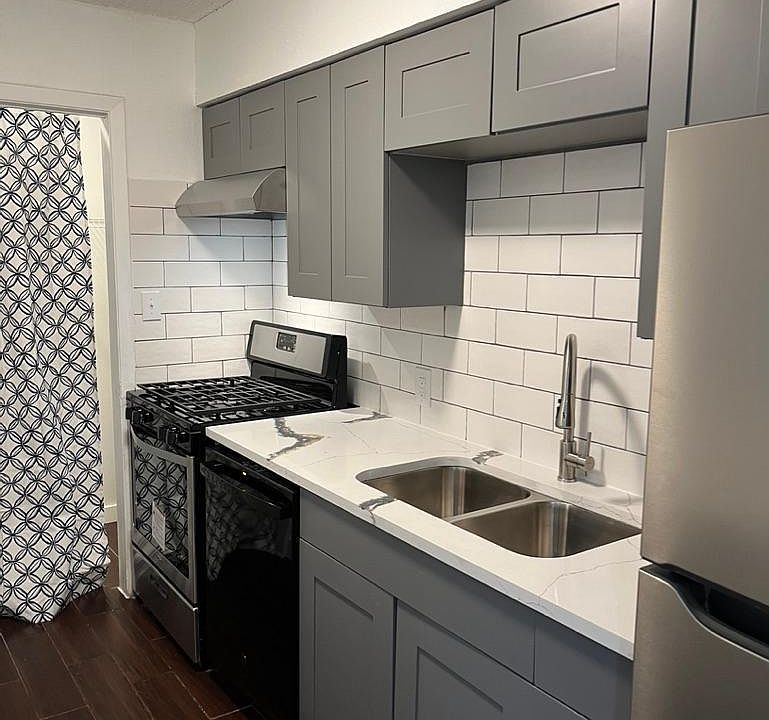 galley kitchen new cabinets and sink and appliances